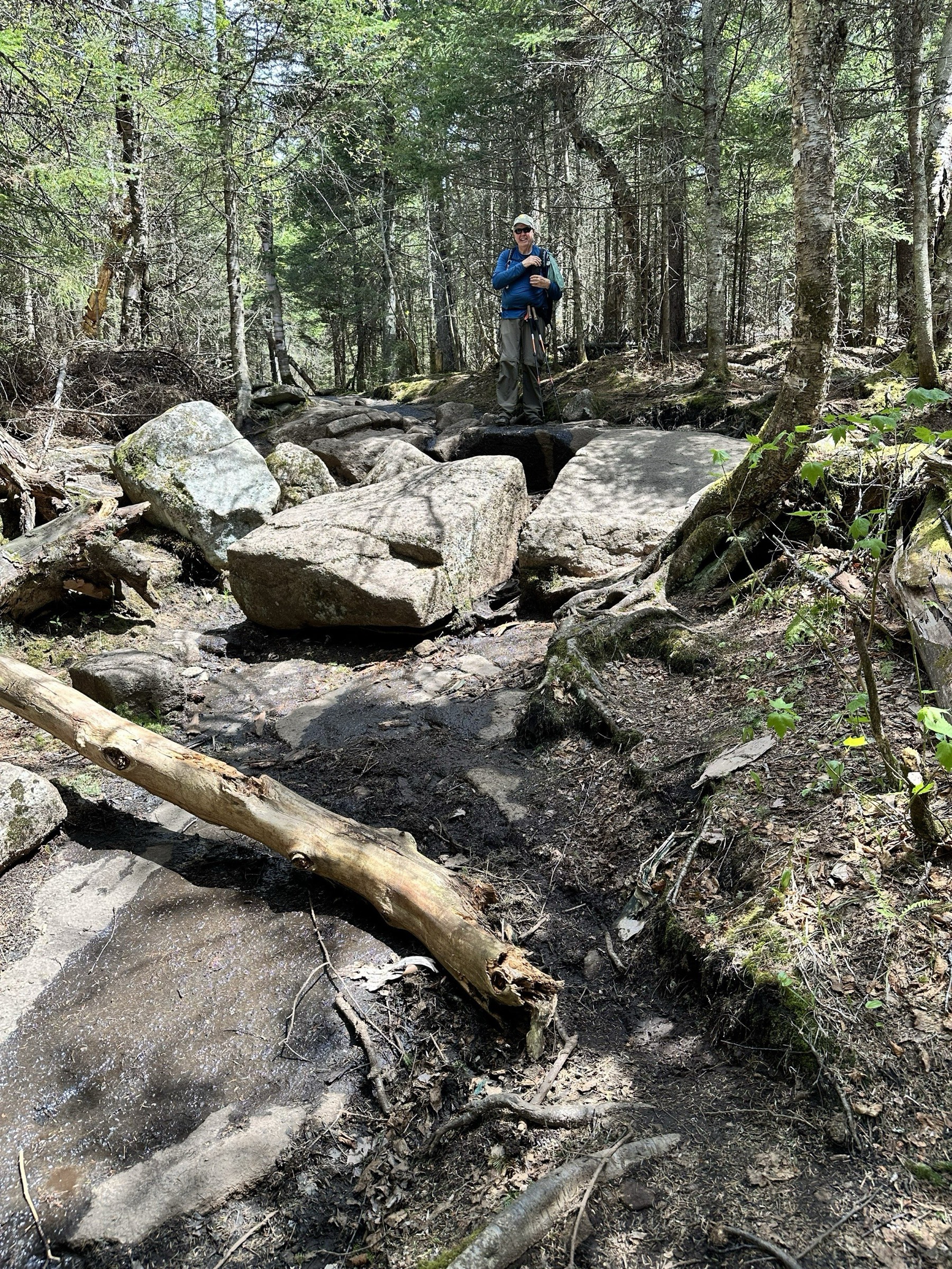 Negotiating boulders and a wet stretch of trail on the climb up Cascade.